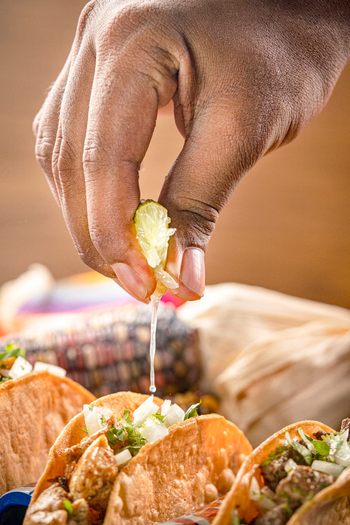 A fresh lime squeezed over tacos
