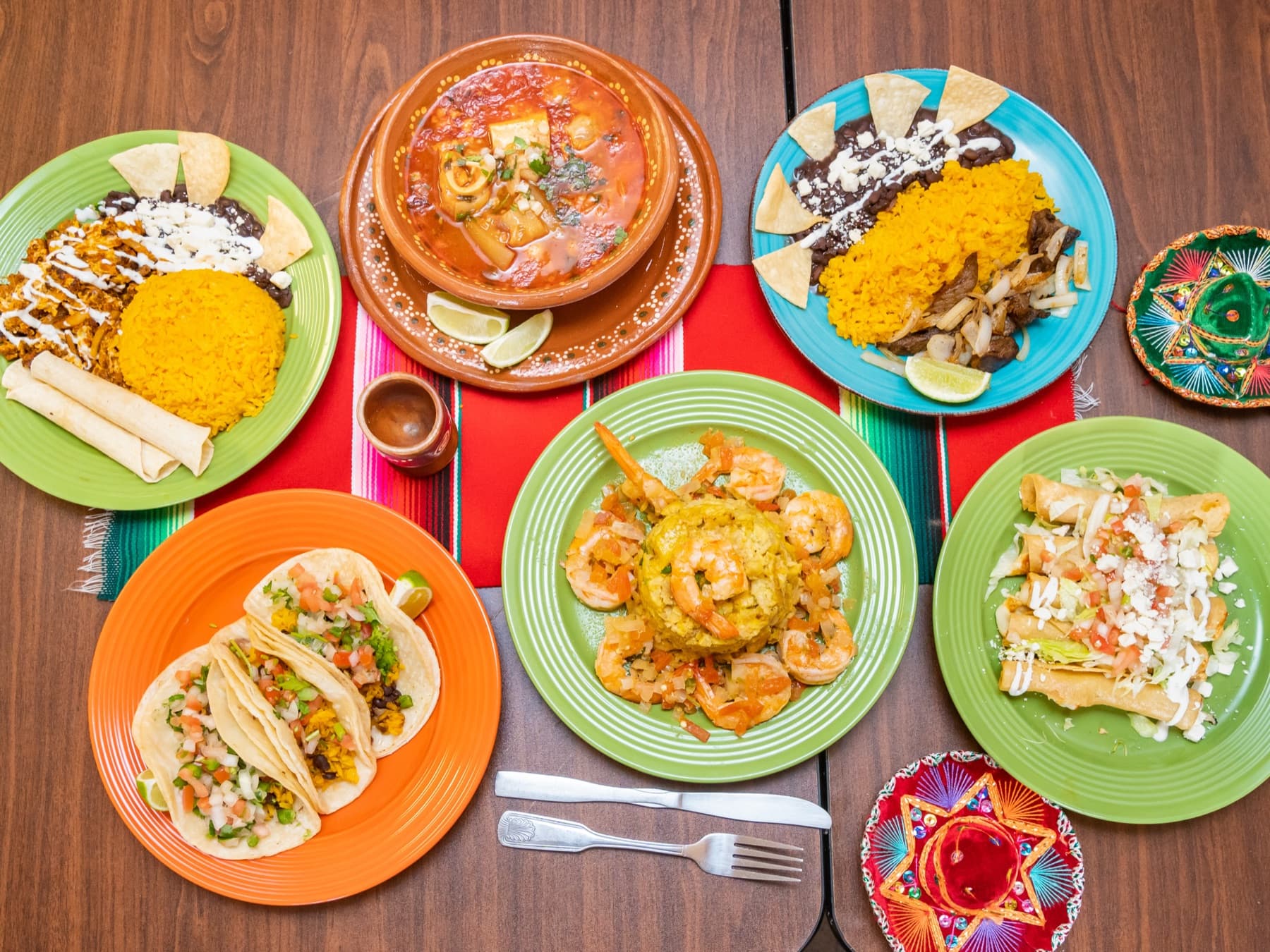 A colorful spread of Rinconcito Domex Dominican and Mexican dishes